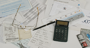 Financial documents, calculator, and credit cards.