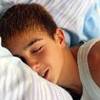 Teen boy sleeping.