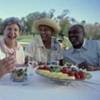 Elderly couples dining outdoors.