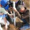 Citizen scientist volunteers assisting in the installation of groundwater monitoring wells.