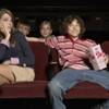 Teenagers on a movie theater date.