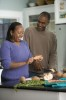 Older couple preparing a meal.