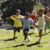 A group of children running.