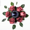 A camera lense surrounded by roses.