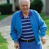 An older man walking with cane.