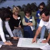 A small group of people looking at a map.