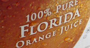 close-up photo of an orange juice label reading 100% PURE FLORIDA ORANGE JUICE
