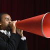 A man yelling into megaphone.