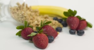 Strawberries, blueberries, cereal grains, and a banana. Fragaria, fruits, foods, red, sweets, healthy eating. UF/IFAS Photo: Tyler Jones.