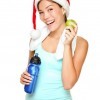 Woman in a workout outfit and Santa hat.