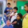 Children standing for the pledge of allegiance