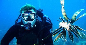 A scuba diver and a lionfish