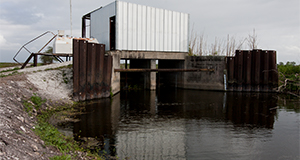 An irrigation ditch and pump housing close to Belle Glade, Florida.