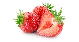 Three strawberries, one cut open and two whole, with a white background