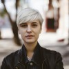 A young woman with short, bleached hair