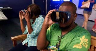 Two people using VR headsets.