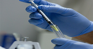 Various laboratory test tubes and fluids. Lab equipment, experiments, research, syringes. UF/IFAS Photo by Tyler Jones.