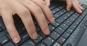Hands operating a keyboard. Credits: UF/IFAS File Photo.