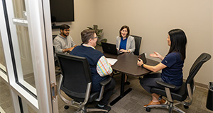 A group meets in a conference room. Photo taken 02-23-23. UF/IFAS Photo by Cat Wofford.